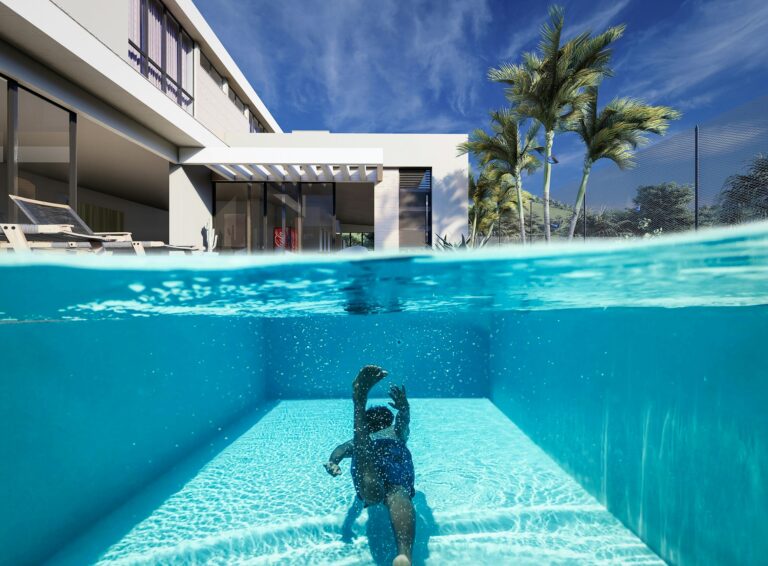A holiday home in the Algarve with a swimming pool and a child swimming.