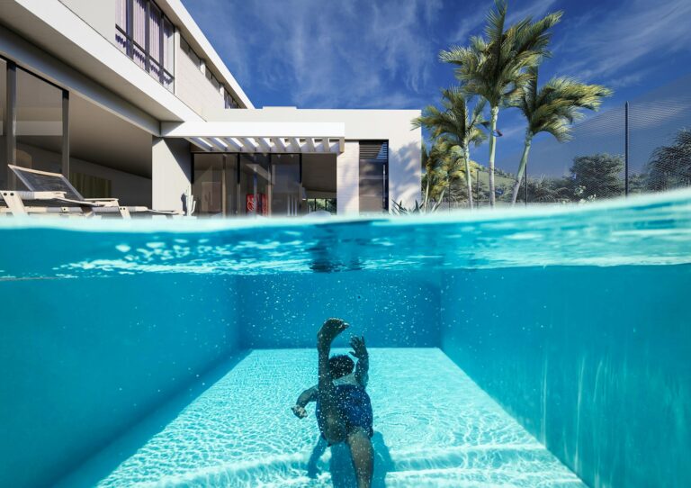 A holiday home in the Algarve with a swimming pool and a child swimming.